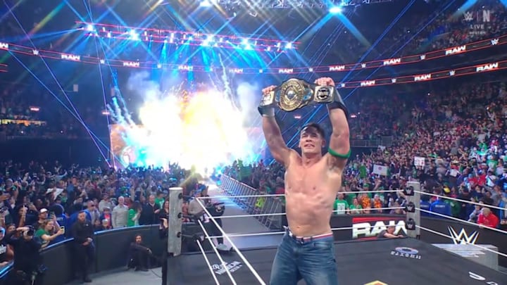 John Cena raises the Intercontinental Championship after defeating Dominic Mysterio at Raw in Boston, Massachusetts on 11/11/2025