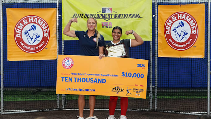 Jennie Finch and award winner Marley Jackson pose for a picture after she receives the award and accompanying scholarship from sponsor Arm & Hammer.