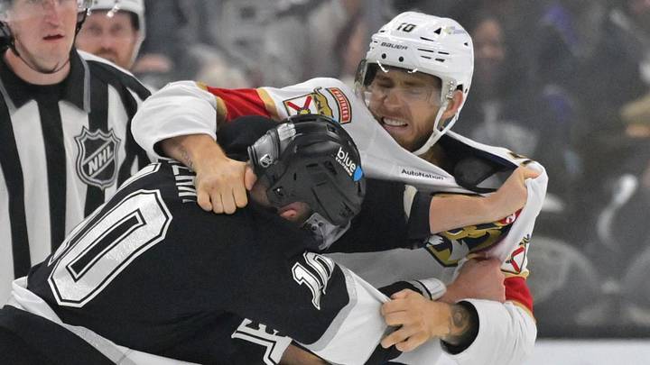 Nov 6, 2025; Los Angeles, California, USA;  Los Angeles Kings right wing Corey Perry (10) and Florida Panthers left wing A.J. Greer (10) fight during the third period at Crypto.com Arena. Mandatory Credit: Jayne Kamin-Oncea-Imagn Images