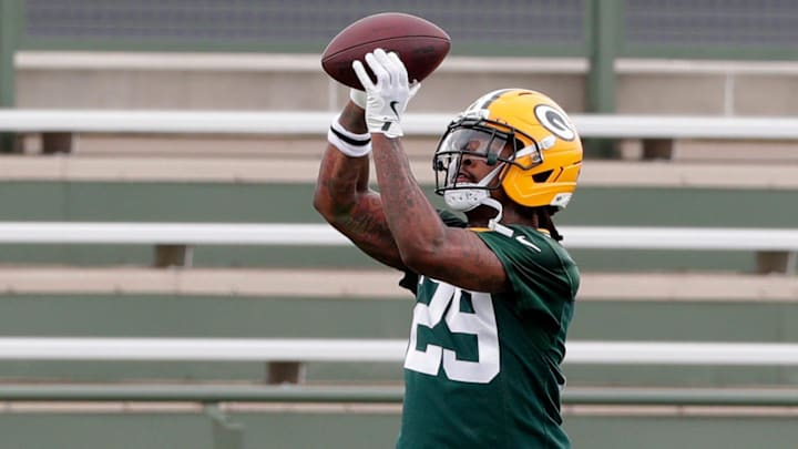 Green Bay Packers safety Xavier McKinney catches a pass at minicamp.