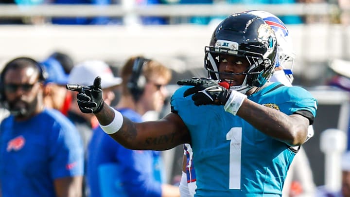 Jacksonville Jaguars running back Travis Etienne Jr. (1) signals a first down during the third quarter in an NFL football AFC Wild Card playoff matchup, Sunday, Jan. 11, 2026, in Jacksonville, Fla. Bills lead 10-7 at the half over the Jaguars. The Bills defeated the Jaguars 27-24. [Doug Engle/Florida Times-Union]