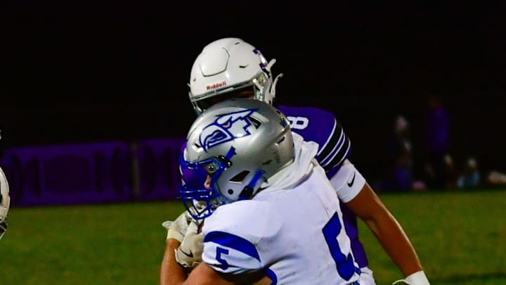 Albany football junior Connor Plumski tackles Foley sophomore Jacob DeMarais during a game Oct. 15, 2025 in Albany. The Huskies won 35-9.