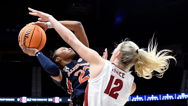 Auburn guard Honesty Scott-Grayson (23) shoots against Alabama forward Allie Craig Cruce (12) during