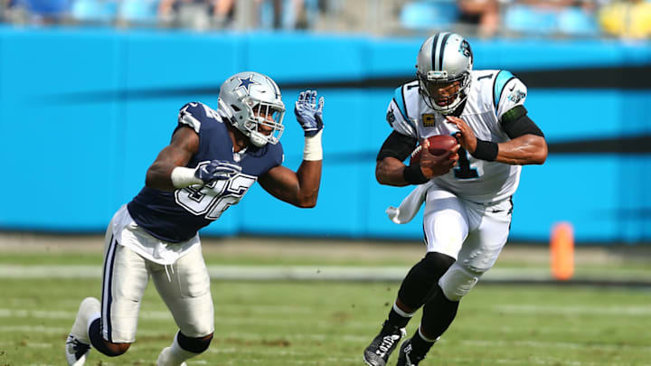 Sep 9, 2018; Charlotte, NC, USA; Carolina Panthers quarterback Cam Newton (1) runs the ball in the first quarter against Dallas Cowboys defensive end Dorance Armstrong (92) at Bank of America Stadium.