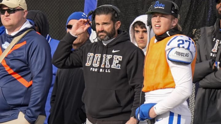 Nov 30, 2024; Winston-Salem, North Carolina, USA; Duke Blue Devils head coach Manny Diaz on the sideline during the second half against the Wake Forest Demon Deacons at Allegacy Federal Credit Union Stadium. Mandatory Credit: Jim Dedmon-Imagn Images Nov 30, 2024; Winston-Salem, North Carolina, USA; Duke Blue Devils head coach Manny Diaz on the sideline during the second half against the Wake Forest Demon Deacons at Allegacy Federal Credit Union Stadium. Mandatory Credit: Jim Dedmon-Imagn Images