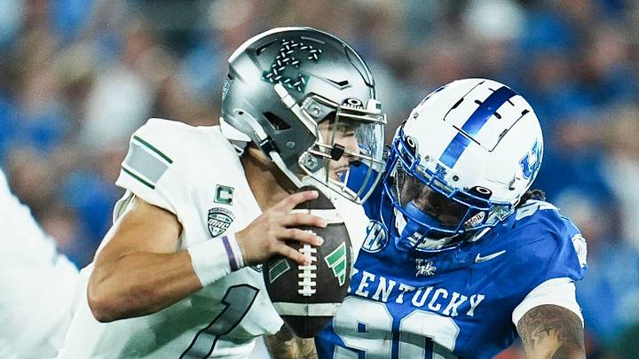 Kentucky Wildcats defensive lineman Mi'Quise Humphrey-Grace (90) pressures Eastern Michigan quarter back Noah Kim during the Wildcats' 48-23 win at Kroger Field in Lexington, Kentucky Saturday, Sept. 13, 2025. Kentucky Wildcats defensive lineman Mi'Quise Humphrey-Grace (90) pressures Eastern Michigan quarter back Noah Kim during the Wildcats' 48-23 win at Kroger Field in Lexington, Kentucky Saturday, Sept. 13, 2025.