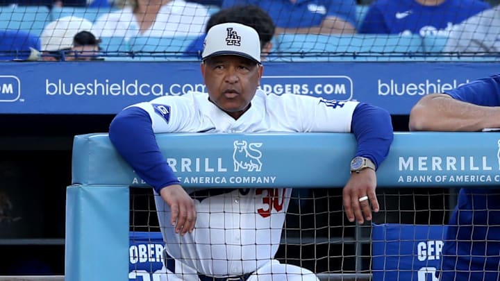 Jul 4, 2024; Los Angeles, California, USA; Los Angeles Dodgers manager Dave Roberts (30) during the first inning against the Arizona Diamondbacks at Dodger Stadium. Mandatory Credit: Jason Parkhurst-USA TODAY Sports