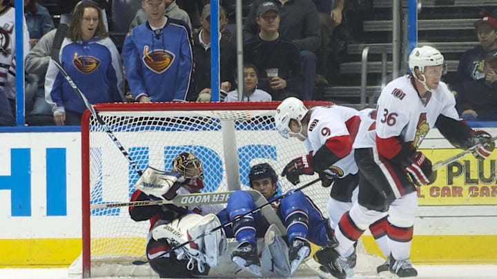 Mar 27, 2011; Atlanta, GA, USA;   Atlanta Thrashers left wing Andrew Ladd (16) ends up in the net on