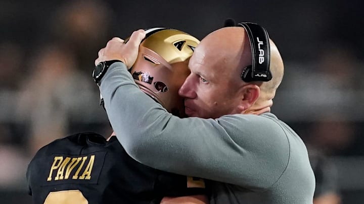 Vanderbilt quarterback Diego Pavia (2) hugs coach Clark Lea during the fourth quarter against Kentucky at FirstBank Stadium in Nashville, Tenn., Saturday, Nov. 22, 2025. Vanderbilt quarterback Diego Pavia (2) hugs coach Clark Lea during the fourth quarter against Kentucky at FirstBank Stadium in Nashville, Tenn., Saturday, Nov. 22, 2025.