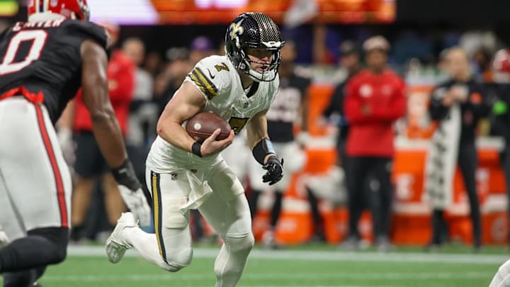 Nov 26, 2023; Atlanta, Georgia, USA; New Orleans Saints quarterback Taysom Hill (7) runs the ball against the Atlanta Falcons in the second half at Mercedes-Benz Stadium. Mandatory Credit: Brett Davis-USA TODAY Sports