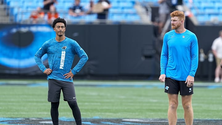Sep 29, 2024; Charlotte, North Carolina, USA; Carolina Panthers quarterback Bryce Young (9) and quarterback Andy Dalton (14) during pregame warm ups against the Cincinnati Bengals at Bank of America Stadium. Sep 29, 2024; Charlotte, North Carolina, USA; Carolina Panthers quarterback Bryce Young (9) and quarterback Andy Dalton (14) during pregame warm ups against the Cincinnati Bengals at Bank of America Stadium.