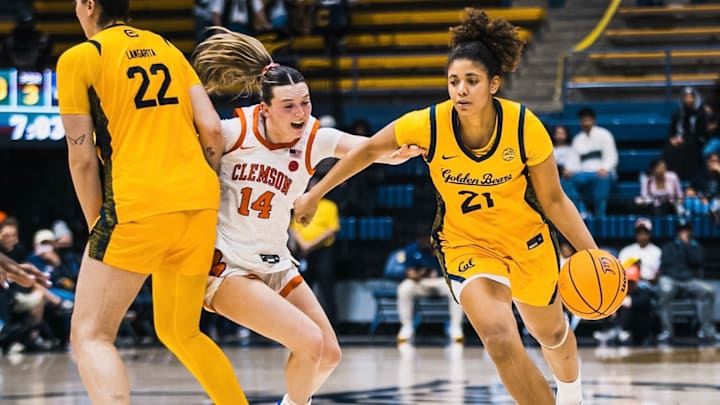 Cal's Gisella Maul (21) dribbles past a screen
