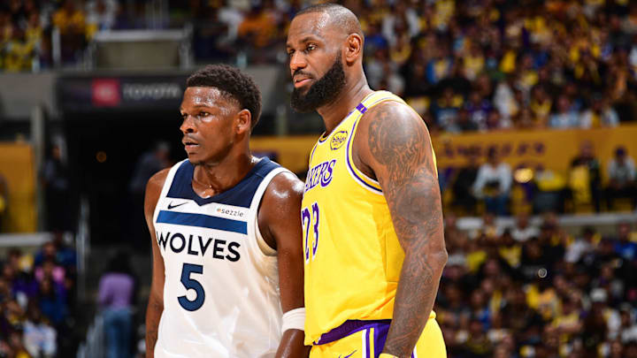 Anthony Edwards and LeBron James look on during a game between the Timberwolves and Lakers in October 2024.