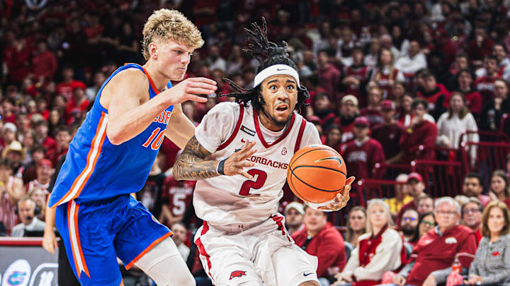 Boogie Fland drives to the basket against Thomas Haugh of Florida on January 11. The Gators won 71-63.