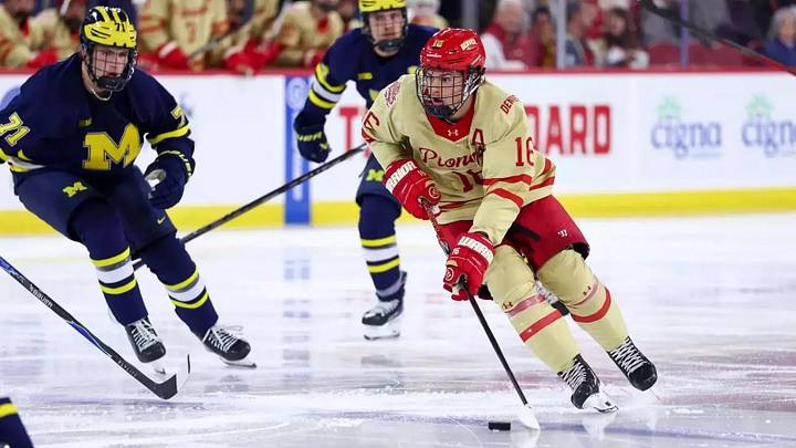 Denver forward Kyle Chyzowski skates with the pick against Michigan in an early-season No. 1 vs. matchup in college hockey. Denver forward Kyle Chyzowski skates with the pick against Michigan in an early-season No. 1 vs. matchup in college hockey.