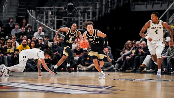 Nate Calmese dribbles ball up the court for the Deacs against Michigan 