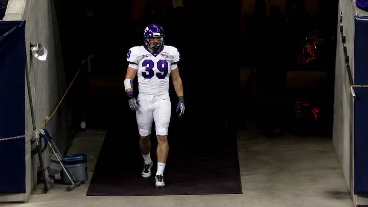 TCU linebacker Jason Phillips walks out of the tunnel before the 2007 Texas Bowl, where the Horned Frogs defeated Houston, 20-13. TCU linebacker Jason Phillips walks out of the tunnel before the 2007 Texas Bowl, where the Horned Frogs defeated Houston, 20-13.