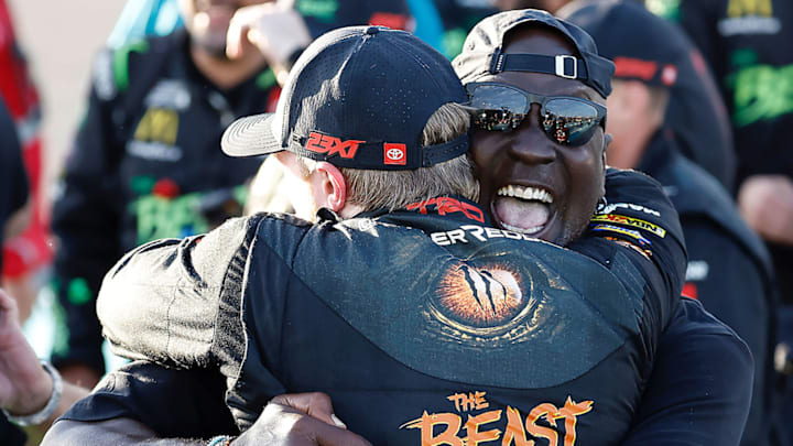 Michael Jordan bearhugs Tyler Reddick following the 23XI Racing driver's win in the Straight Talk Wireless 400 at Homestead-Miami Speedway. The win secured Reddick a berth in the Championship 4. Michael Jordan bearhugs Tyler Reddick following the 23XI Racing driver's win in the Straight Talk Wireless 400 at Homestead-Miami Speedway. The win secured Reddick a berth in the Championship 4.