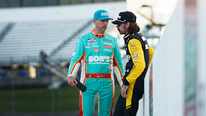 Denny Hamlin (left) chats with Ryan Blaney (right) after Sunday's NASCAR Cup Series Cook Out 400 at Martinsville Speedway.