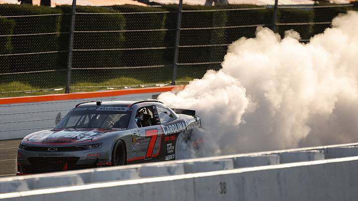 Justin Allgaier celebrates a win in the MillerTech Battery 250 at Pocono Raceway. Justin Allgaier celebrates a win in the MillerTech Battery 250 at Pocono Raceway.