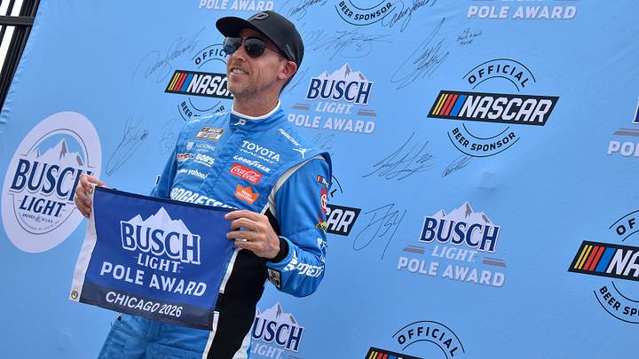 Denny Hamlin celebrates his pole-winning run for Sunday's eero 400 at Chicagoland Speedway.