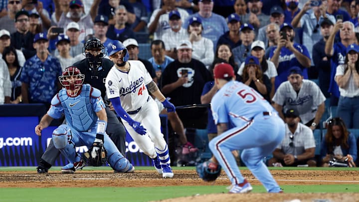 Kerkering fields the ball before making an errant throw to home plate to end the Phillies' 2025 season.