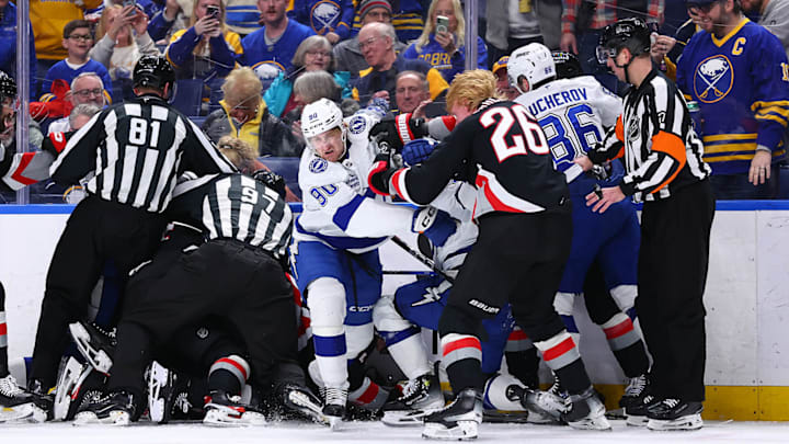 Officials deal with a pileup of players in the matchup between Buffalo and Tampa Bay on Sunday night.