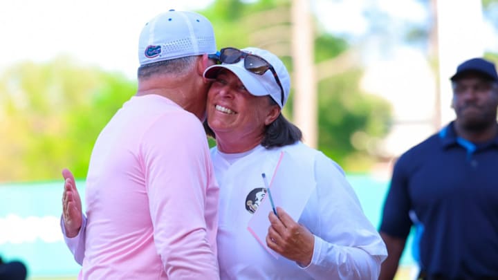 Florida's head coach Tim Walton and Florida State's Lonnie Alameda embrace before exchanging lineups on April 2, 2025.