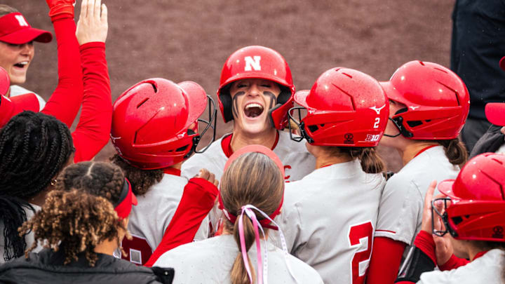 Nebraska softball star Jordy Bahl celebrates with her teammates after hitting a grand slam against Iowa.