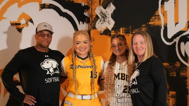 UMBC softball coaches Angie (far right) and Rick (far left) were fired after just 18 games.