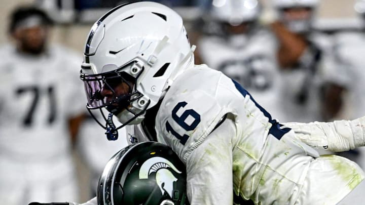 Michigan State's Alessio Milivojevic, center, is sacked by Penn State's King Mack, top, and Amare Campbell during the fourth quarter on Saturday, Nov. 15, 2025, at Spartan Stadium in East Lansing. Michigan State's Alessio Milivojevic, center, is sacked by Penn State's King Mack, top, and Amare Campbell during the fourth quarter on Saturday, Nov. 15, 2025, at Spartan Stadium in East Lansing.