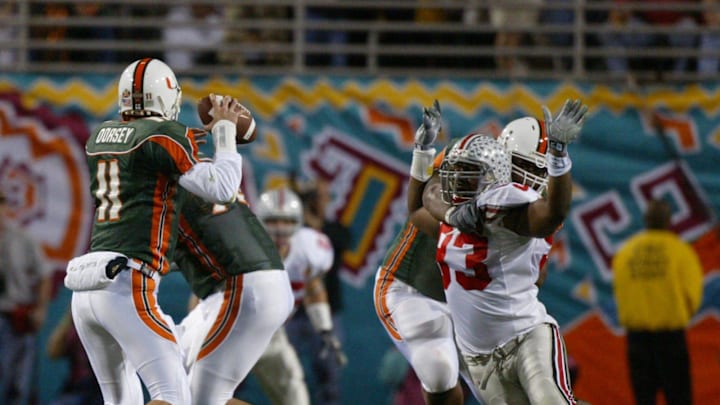 (NCL FIESTA 3JAN03) 2003 Fiesta Bowl -- OSU vs. Miami -- Ohio State's Will Smith is held by Miami's Carlos Joseph as he tries to get to Miami's quarterback Ken Dorsey during the first quarter of the National College Football Championship at Sun Devil Stadium in Tempe, Arizona, January 3, 2003 (Dispatch photo by Neal C. Lauron)

Ncl Fiesta