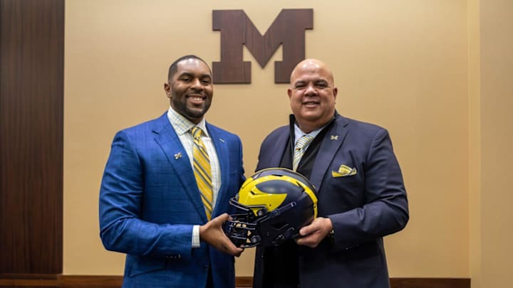 Michigan head football coach Sherrone Moore, left, and athletic director Warde Manuel, right, pose for a photo at Moore's introductory press conference. Michigan head football coach Sherrone Moore, left, and athletic director Warde Manuel, right, pose for a photo at Moore's introductory press conference.