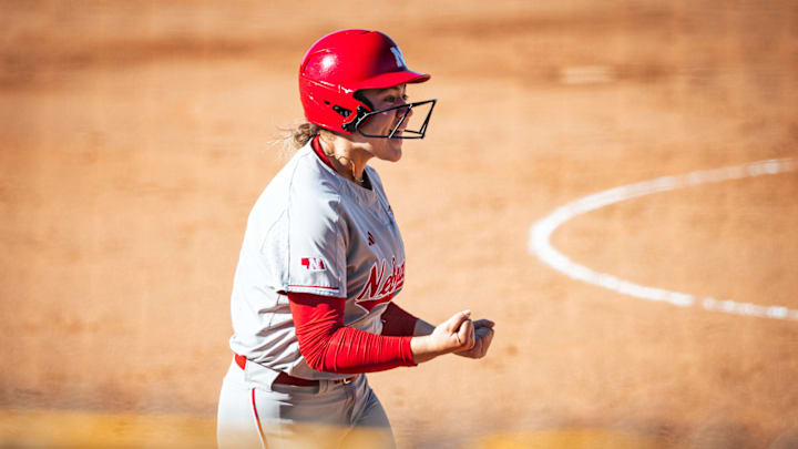 Nebraska's Bella Bacon celebrates hitting a home run against Baylor at the Mary Nutter Collegiate Classic.