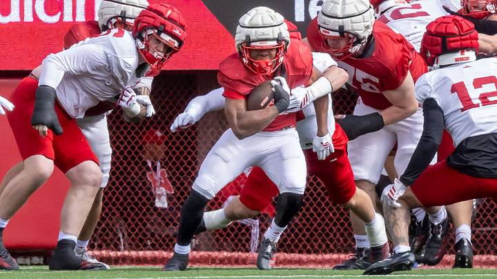 Running back Jamal Rule tries to escape a defender's grasp during the Red-White Spring Game. Running back Jamal Rule tries to escape a defender's grasp during the Red-White Spring Game.