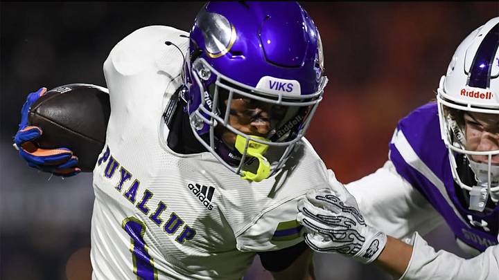 Puyallup's J'Isaiah Mitchell (1) pulls away from a defender during his team's win over No. 1 Sumner on Friday, October 16, 2026. Puyallup's J'Isaiah Mitchell (1) pulls away from a defender during his team's win over No. 1 Sumner on Friday, October 16, 2026.