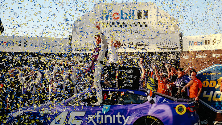 Tyler Reddick and his son, Beau, celebrate a win in the Goodyear 400 at Darlington Raceway.