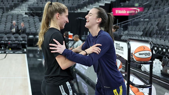 Kate Martin and college teammate Caitlin Clark share a laugh before a game between the Fever and Aces.