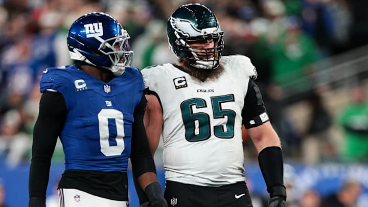 Giants linebacker Brian Burns chats with Eagles right tackle Lane Johnson during the fourth quarter Thursday night at MetLife Stadium.