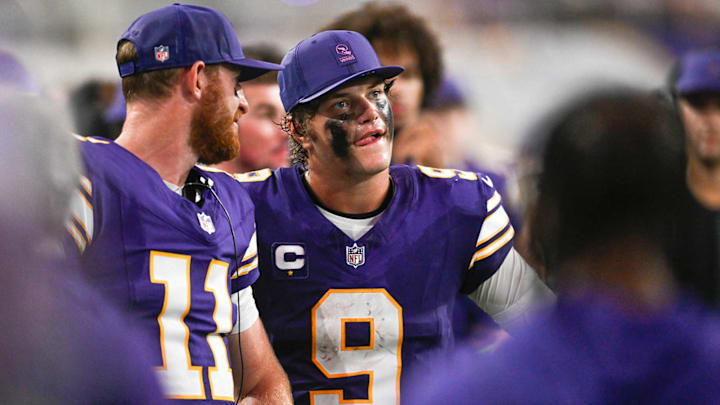 J.J. McCarthy and Carson Wentz look on from the sideline during the Vikings' 22-6 loss to the Falcons in Week 2.