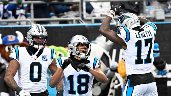 Dec 15, 2024; Charlotte, North Carolina, USA; Carolina Panthers wide receiver Jalen Coker (18) celebrates with tight end Ja'Tavion Sanders (0) and wide receiver Xavier Legette (17) after scoring a touchdown in the second quarter at Bank of America Stadium. 