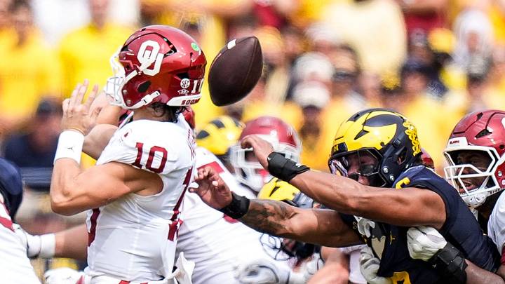 Michigan defensive end Dom Nichols (8) forces Oklahoma quarterback John Mateer (10) to fumble during the first half at Michigan Stadium in Ann Arbor on Saturday, Sept. 12, 2026. Michigan defensive end Dom Nichols (8) forces Oklahoma quarterback John Mateer (10) to fumble during the first half at Michigan Stadium in Ann Arbor on Saturday, Sept. 12, 2026.