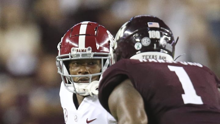 Oct 9, 2021; College Station, Texas, USA;  Texas A&M linebacker Aaron Hansford (1) closes in to tackle Alabama wide receiver John Metchie III (8) at Kyle Field. Texas A&M defeated Alabama 41-38 on a field goal as time expired. Mandatory Credit: Gary Cosby Jr.-USA TODAY Sports