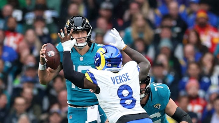 [US, Mexico & Canada customers only] Oct 19, 2025; London, United Kingdom; Los Angeles Rams linebacker Jared Verse (8) defends Jacksonville Jaguars quarterback Trevor Lawrence (16) as Jacksonville Jaguars guard Ezra Cleveland (76) blocks during the first half during a NFL International Series game at Wembley Stadium. Mandatory Credit: Andrew Boyers-Reuters via Imagn Images