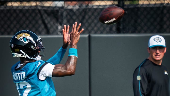 Jacksonville Jaguars wide receiver Travis Hunter (12) hauls in a pass while running routes during the seventh organized team activity at the Miller Electric Center in Jacksonville, Fla. Monday, June 2, 2025. [Doug Engle/Florida Times-Union]