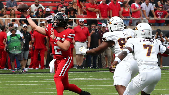 Sep 21, 2024; Lubbock, Texas, USA;  Texas Tech Red Raiders quarterback Behren Morton (2) throws a pass against Arizona State Sun Devils defensive lineman CJ Fite (99) in the first half at Jones AT&T Stadium and Cody Campbell Field. Mandatory Credit: Michael C. Johnson-Imagn Images