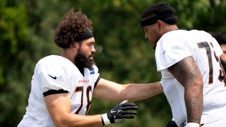 Cincinnati Bengals offensive tackle Devin Cochran (76) and Cincinnati Bengals offensive tackle Orlando Brown Jr. (75) perform a offensive line drill at Cincinnati Bengals training camp on the Kettering Health Practice Fields in Cincinnati on Sunday, Aug. 4, 2024. Cincinnati Bengals offensive tackle Devin Cochran (76) and Cincinnati Bengals offensive tackle Orlando Brown Jr. (75) perform a offensive line drill at Cincinnati Bengals training camp on the Kettering Health Practice Fields in Cincinnati on Sunday, Aug. 4, 2024.