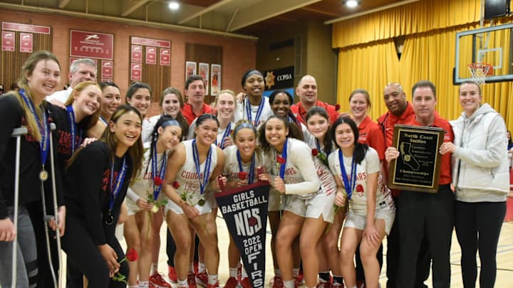 Sabrina Ionescu (right) takes a team picture with Carondelet after winning a North Coast Section championship. She'll take photos with all the winning teams on Saturday, the second of two days of the Sabrina Ionescu Showcase at Carondelet and De La Salle high schools