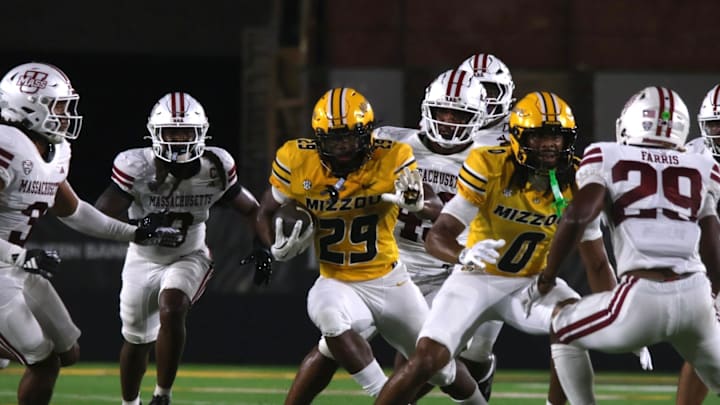Sept 27, 2025; Columbia, Missouri, USA; Missouri Tigers running back Ahmad Hardy (29) directs himself through traffic during a game against UMass.
