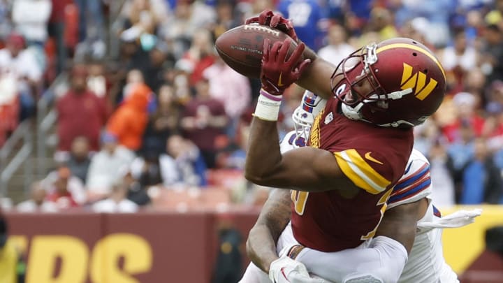 Sep 24, 2023; Landover, Maryland, USA; Washington Commanders cornerback Kendall Fuller (29) intercepts a pass intended for Buffalo Bills wide receiver Gabe Davis (13) at FedExField. Mandatory Credit: Geoff Burke-USA TODAY Sports